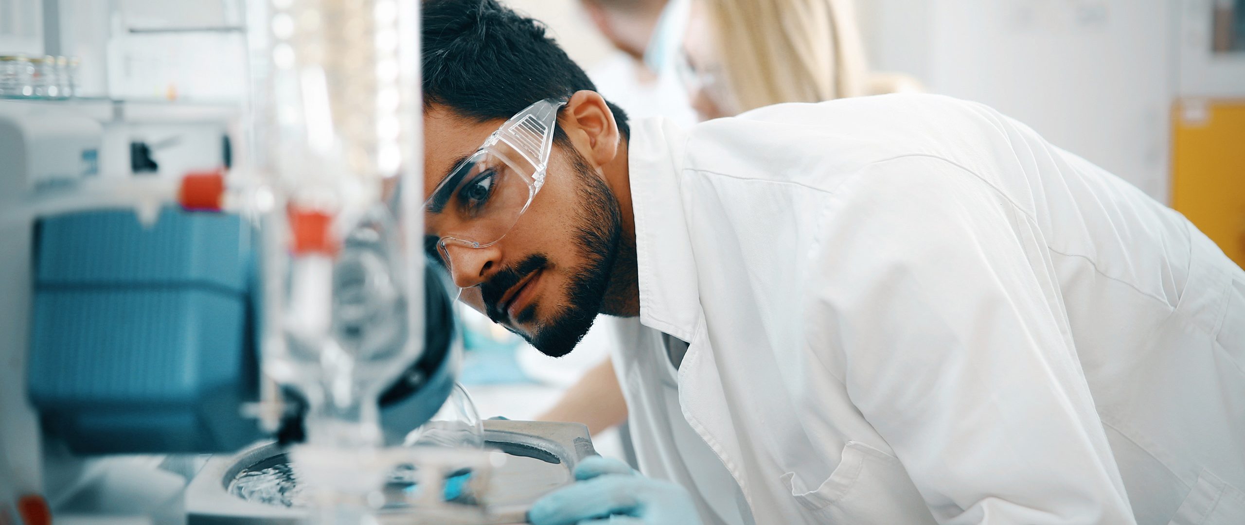 Young students of chemistry working in laboratory Young students of chemistry working together in laboratory